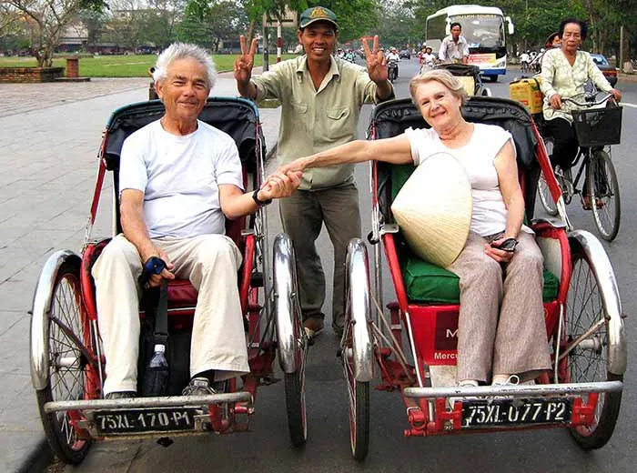 Couple on anniversary pedicab tour in Phnom Penh, Cambodia