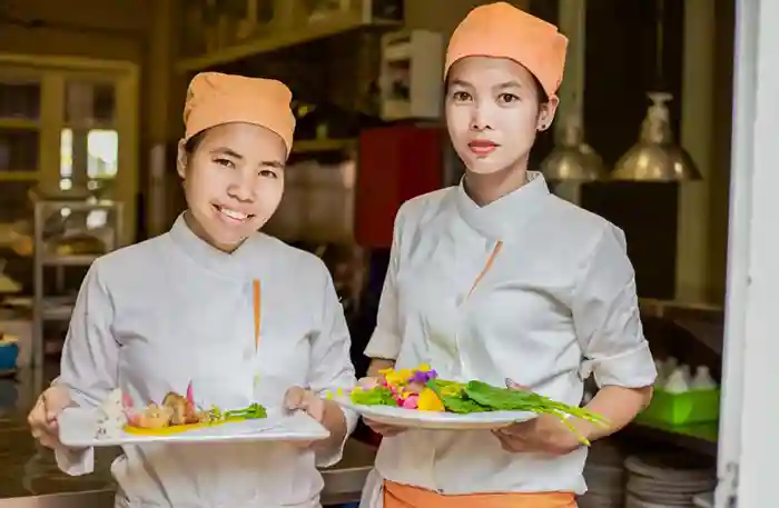 Twin chefs Kimsan sisters at Embassy Restaurant in Siem Reap