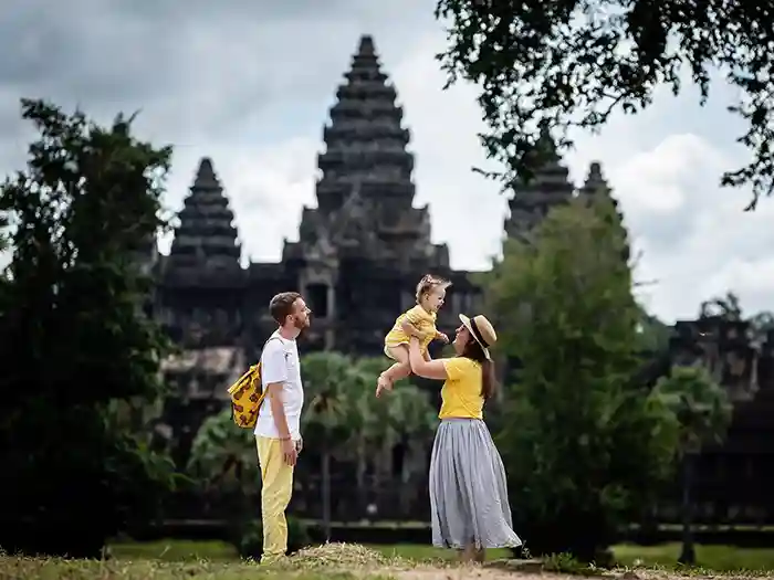 Family in front of Angkor Wat in Siem Reap, Cambodia