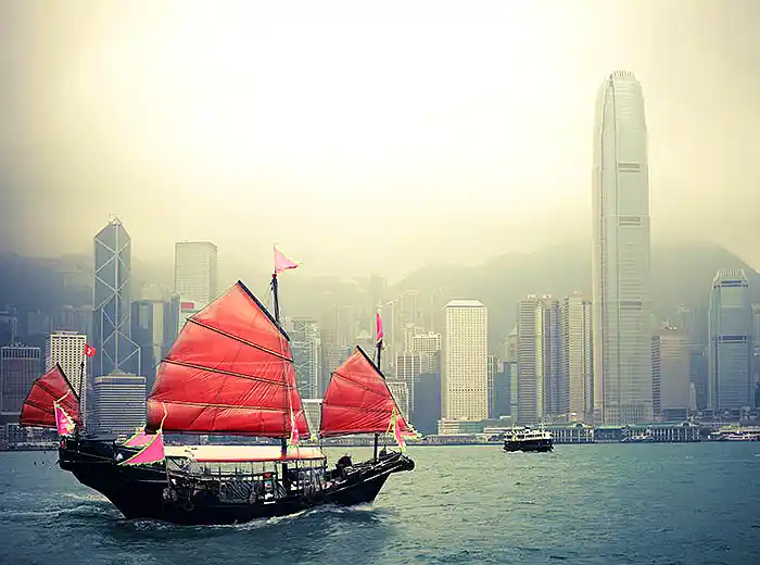 Wooden junk cruising on Hong Kong harbor.