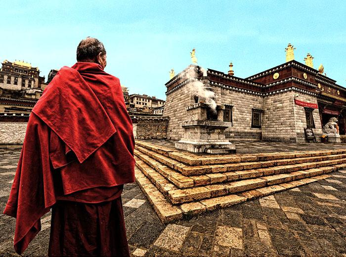 Tibetan monk outside of monastery
