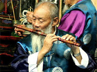 Naxi flutist in Lijiang, China