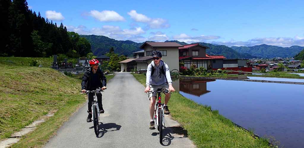 Couple cycling in rural Japan