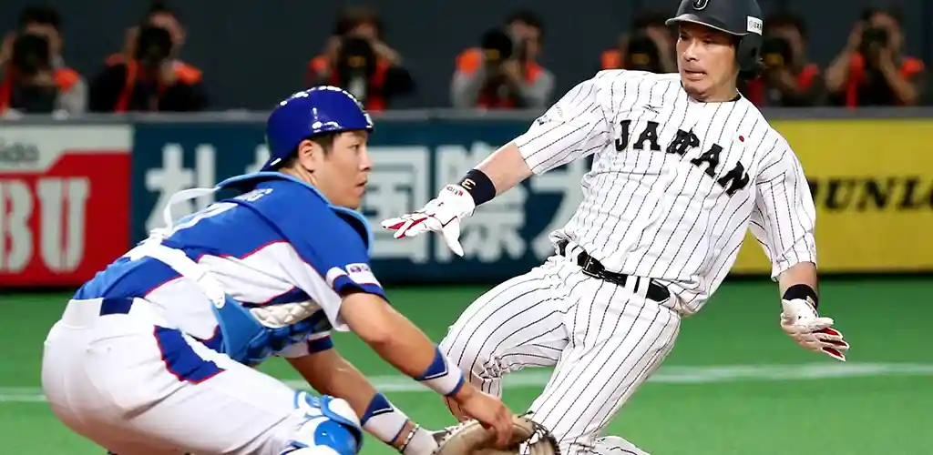 Tokyo Giants Baseball player sliding into home