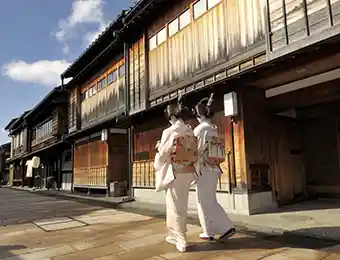 A pair of Geisha walking on the street in Kanazawa, Japan