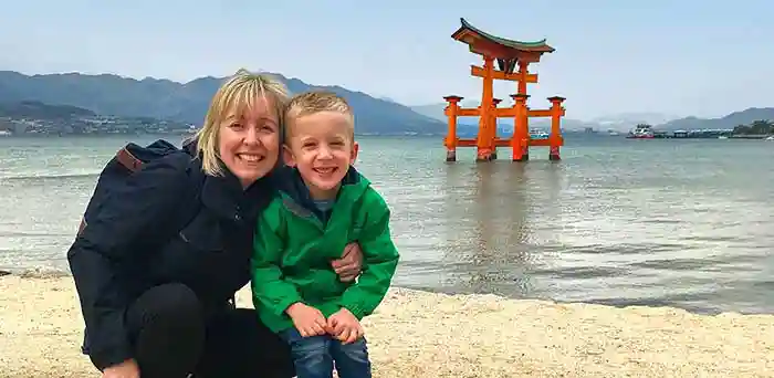 Mother and son at Itsukushima Shrine, Miyajima, Japan