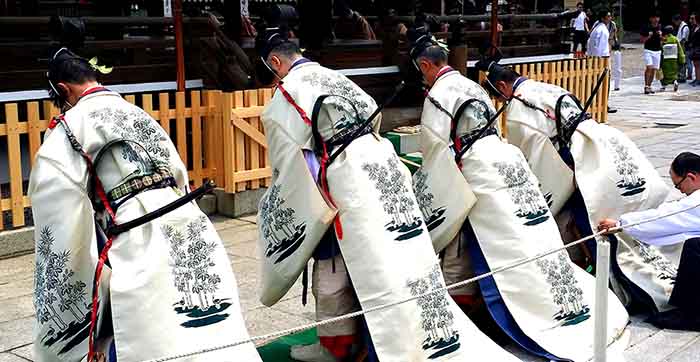 Japanese Shinto priests at ceremony in Kyoto, Japan