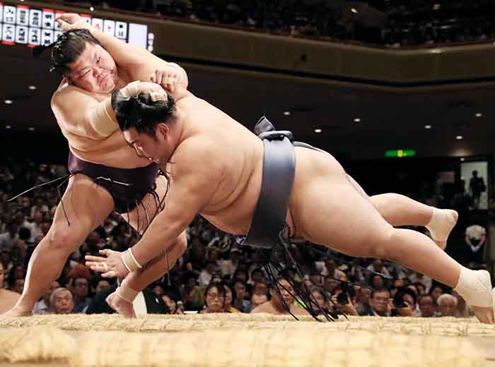 Sumo wresltlers in action  in Tokyo, Japan