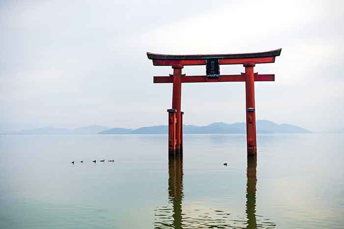 Torii gate on lake in Japan