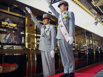 Staff of Seven Stars luxury train in Kyush, Japan