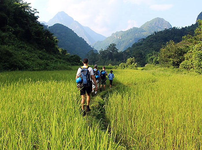 Hikers in valley near Nong Khiaw, Laos