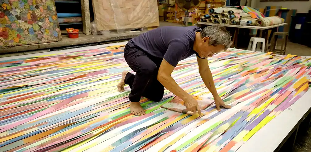 Thai artist Mit Ja Inn at work in his studio