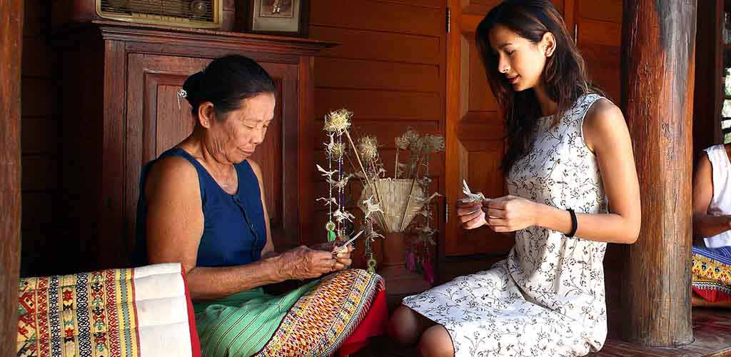 Teen learning crafts in Chiang Mai, Thailand during family tour
