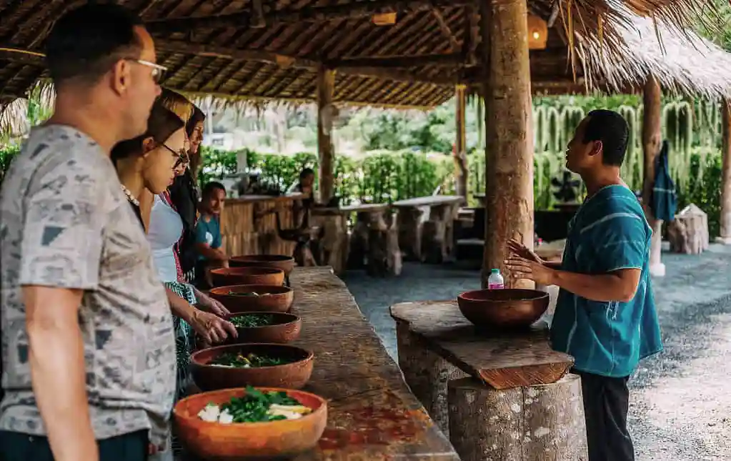 Learning to prep food at the Koh Phangan Elephant Sanctuary in Southern Thailand