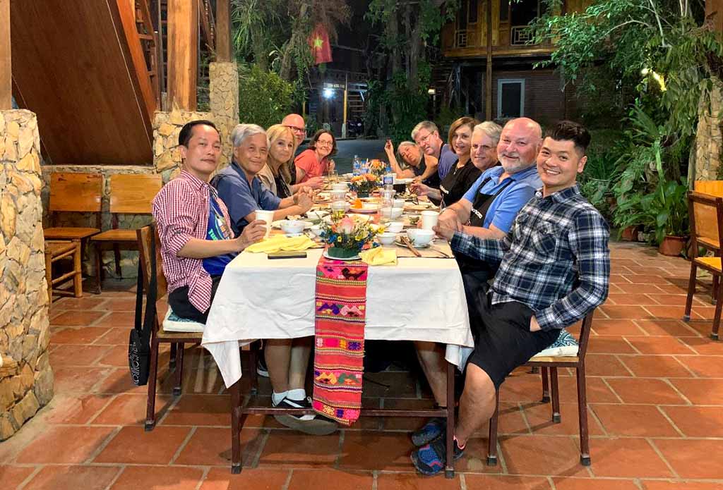 Vietnam food tour group dining in Mau Chau, Vietnam