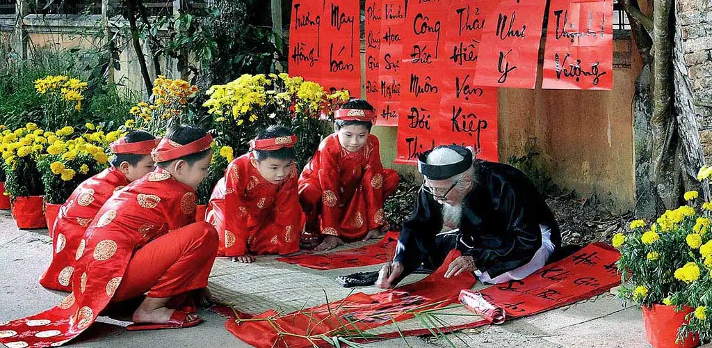 Boys learning calligraphy during the lunar new year in Hanoi.