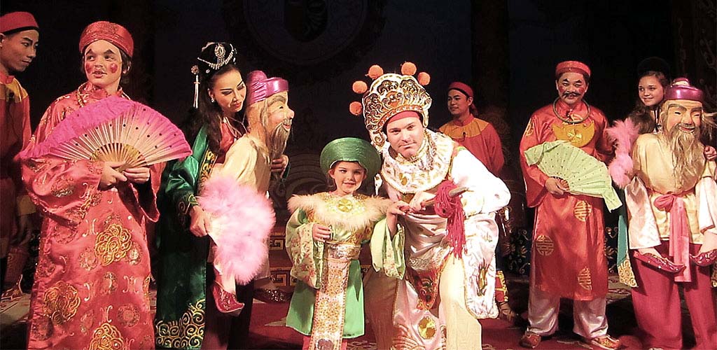 Performing with Hanoi theater troupe during Vietnam family tour